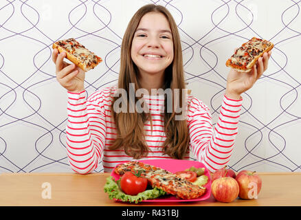 Happy beautiful teenage girl with sandwiches Stock Photo