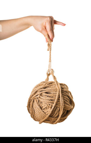 in a female hand tangle of rope on white isolated background Stock Photo