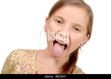 little girl puts out her tongue Stock Photo