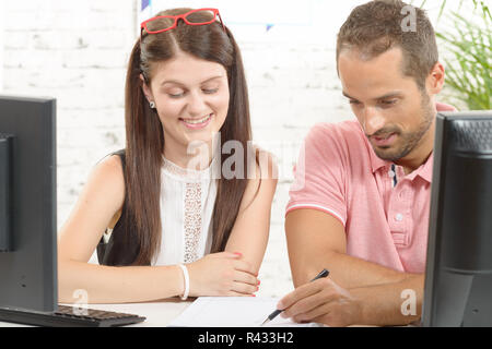 two work colleague in their office Stock Photo