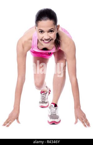 Get set go! Female athlete in action. Stock Photo