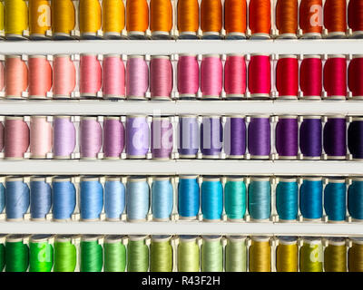Sewing threads multicolored background closeup - fashion design Stock Photo