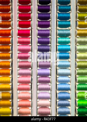 Sewing threads multicolored background closeup - fashion design Stock Photo