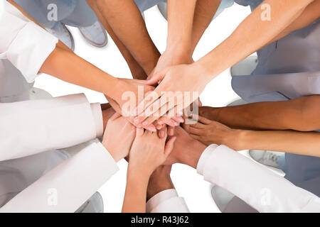 Directly Above Shot Of Medical Team Standing Hands Stock Photo