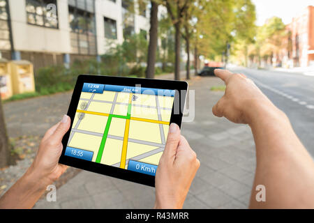 Two People Hands Using Gps Map Navigation Stock Photo