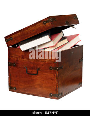 Books in the wooden chest isolated on white Stock Photo