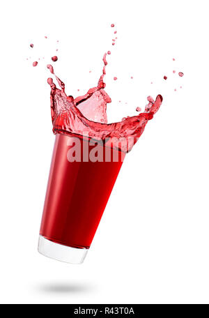 falling glass of red juice or berry compote with splashes isolated on white background Stock Photo
