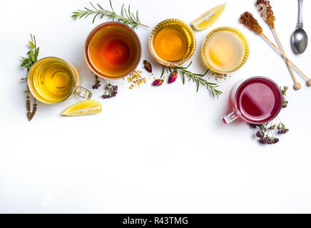 Herbal tea collection prepared in glasses on white background Stock Photo