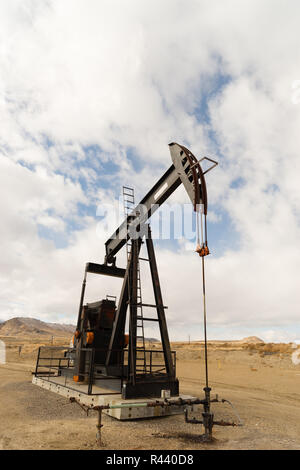 Wyoming Industrial Oil Pump Jack Fracking Crude Extraction Machine Stock Photo