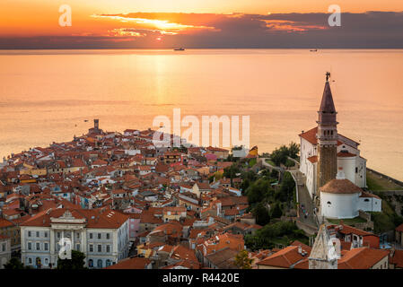 Sunset Over Adriatic Sea and Old Town of Piran, Slovenia Stock Photo