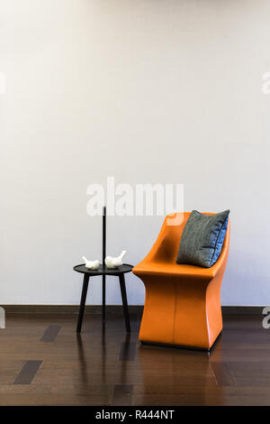 Coffee table Orange Leather chair combination Stock Photo