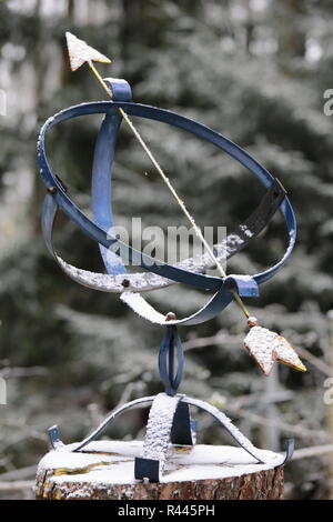 Seasonal clock change. A sundial switched into a wintertime. The nature's ritual of switching between summer and winter time. Stock Photo