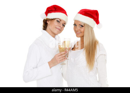 Young women  with glasses of champagne. Christmas. Stock Photo