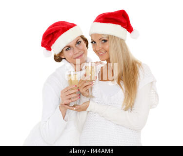 Young women  with glasses of champagne. Christmas. Stock Photo