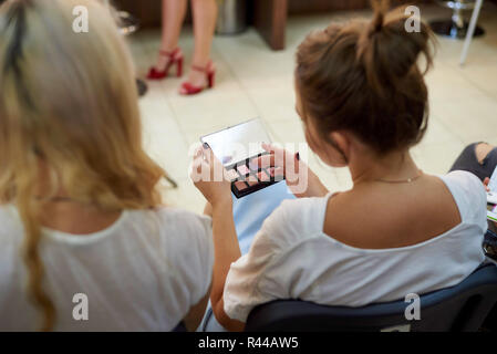 Multicolored palette of shadows in female hands. Stock Photo