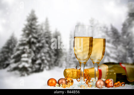 Christmas decorations and champagne against winter background Stock Photo