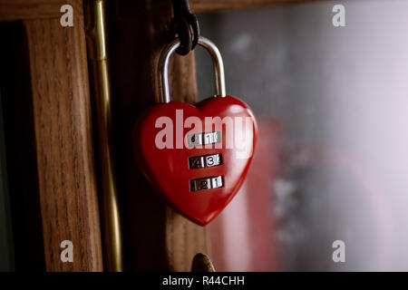 Close up shot of a heart-shaped padlock with numbers. Stock Photo