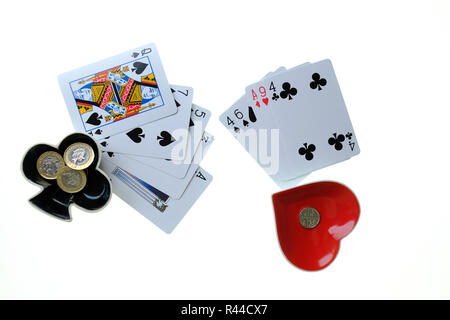 Winning and losing hands. Playing cards from a game of poker on white background with Ace of Clubs and Ace of Hearts Stock Photo