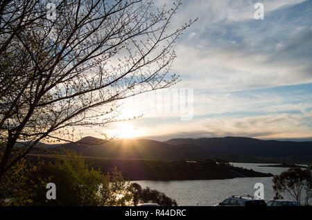 Sunset over lake Jindabyne and mountains Stock Photo