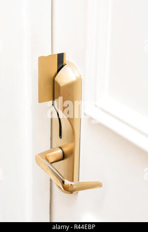 Door lock. Secured key card inserted. Stock Photo