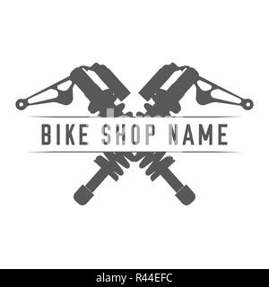 Bikes Shop Emblem. Design Element for Bike Shop or Advertising Banner. Crossed Shock Absorbers and Place for Your Bike Shop Name, Monochrome Illustrat Stock Photo