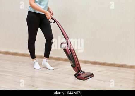 Cleaner woman cleaning kitchen counter with cloth, spray bottle and rubber  gloves in modern home in Stock Photo by YuriArcursPeopleimages