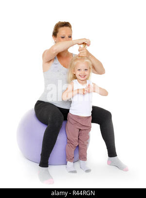 Mum looks after hair of the child. Stock Photo