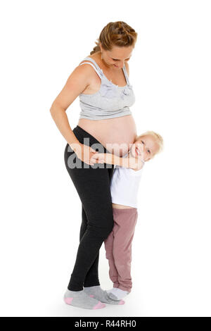 Young pregnant woman with daughter. Stock Photo