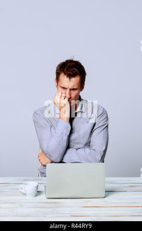 The man working on laptop in the office Stock Photo