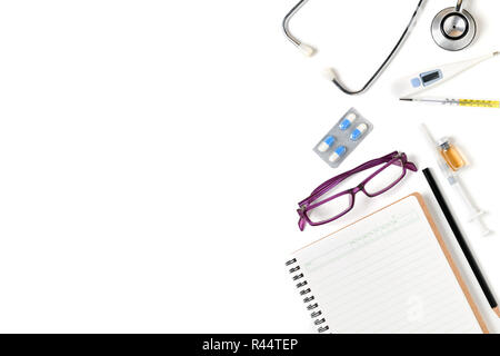 Blank notebook with stethoscope and accessories for doctor isolated on white background, Health care concept and copy space Stock Photo