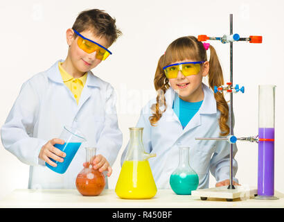 Two cute children at chemistry lesson making experiments Stock Photo