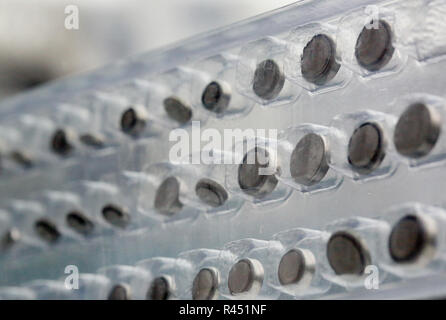 Berlin, Germany. 25th Nov, 2018. ILLUSTRATION - So-called 'button cells' in one package. If small children swallow them, the mini batteries can get stuck in the esophagus and cause burns. (To dpa 'Federal Office warns: Parents should lock away button cells child-resistant') Credit: Stephanie Pilick/dpa/Alamy Live News Stock Photo