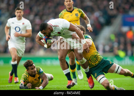 Twickenham, UK. 24th November 2018. England's Joe Cokanasiga is tackled during the Quilter International Rugby match between England and Australia. Andrew Taylor/Alamy Live News Stock Photo