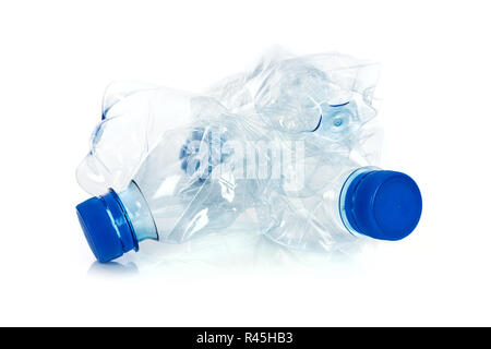 Environmental pollution concept - crumpled plastic bottles isolated on a white background in close-up Stock Photo