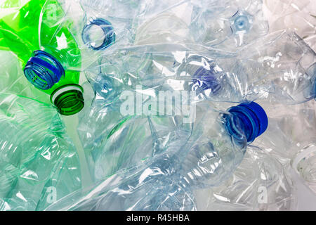 Environmental pollution concept - empty crumpled plastic bottles ready for recycling in close-up. Stock Photo