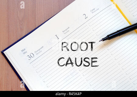 Root cause write on notebook Stock Photo