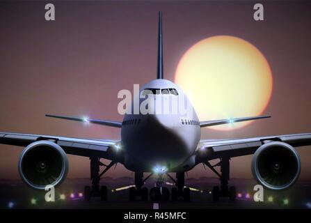 airplane on runaway during sunset Stock Photo