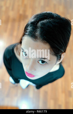 Beautiful woman posing - look up, facial expression, serious woman Stock Photo