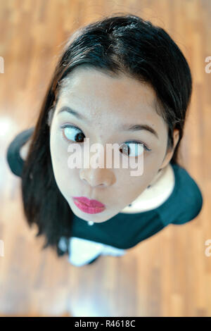 Beautiful woman posing - look up, facial expression, pouting, crazy face Stock Photo