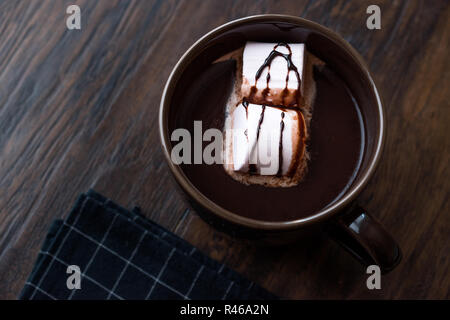 Hot Chocolate with Marshmallow Candies and Sauce. Juicy Dessert. Stock Photo