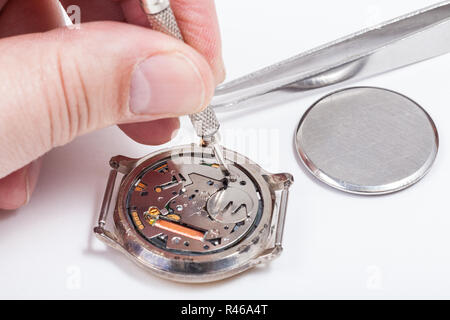horologist replaces battery in quartz watch Stock Photo