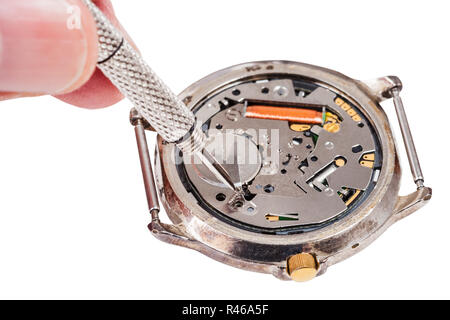 repairer replaces battery in quartz watch isolated Stock Photo
