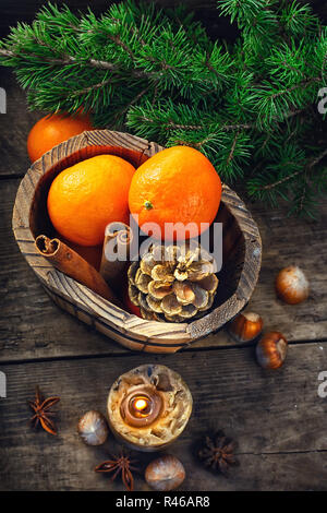 wooden bucket with tangerines Stock Photo