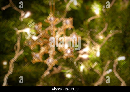 Gold Christmas background of de-focused lights with decorated tree Stock Photo
