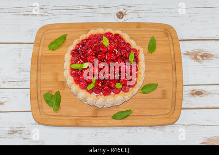 Raspberry cake decorated with mint leaves Stock Photo