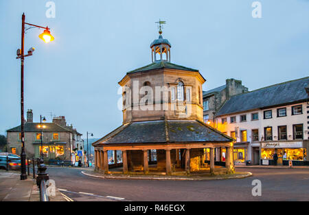 The butter Market / market cross erected in 1747 standing in the high street in the Teesdale market town of Barnard Castle County Durham seen at night Stock Photo