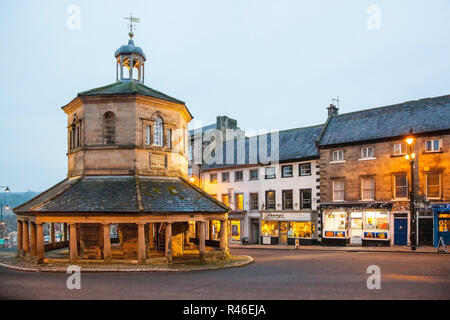 The butter Market / market cross erected in 1747 standing in the high street in the Teesdale market town of Barnard Castle County Durham seen at night Stock Photo