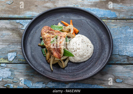 Pan fried ocean perch with sauteeed fennel and jerusalem artishoke puree, copy space Stock Photo
