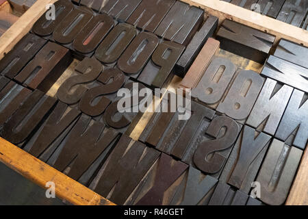 Jumble of different metal letters in a tray for use in an old Heidelberg printing press. Stock Photo