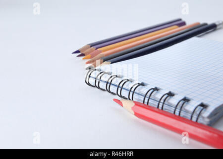 close up.Notepad and pencils on white background .photo with cop Stock Photo